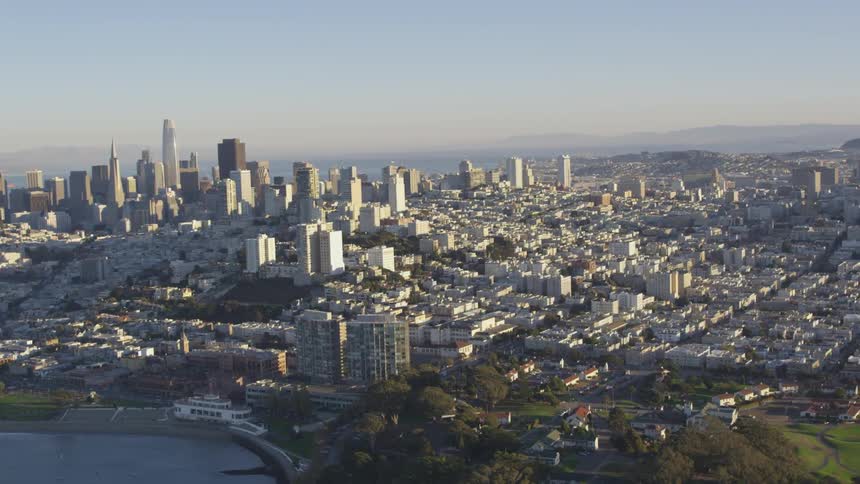 Skyline of the city with distance mountains on a sunny day