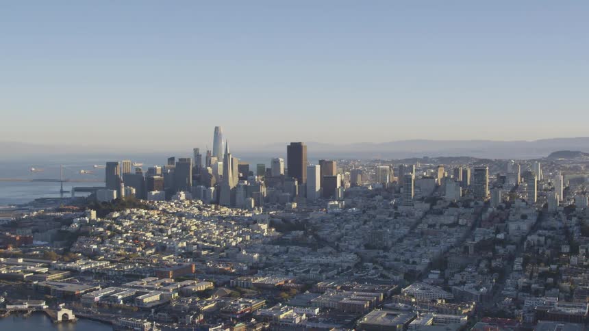 The camera flies next to a large dense city