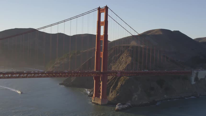 A boat crossing under the bridge
