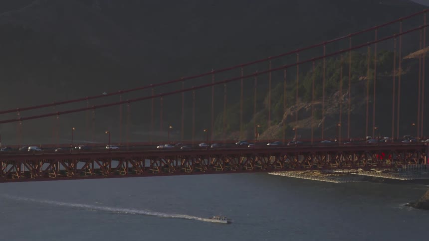Cars driving across a bridge at night