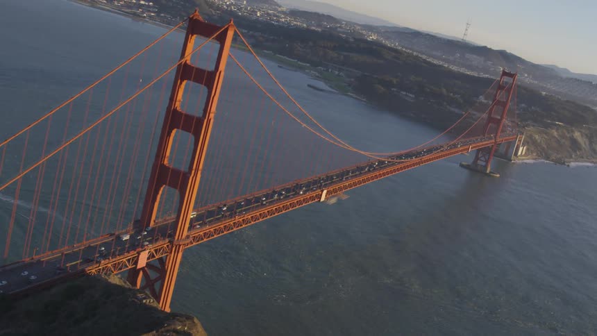 Cars are driving over a bridge
