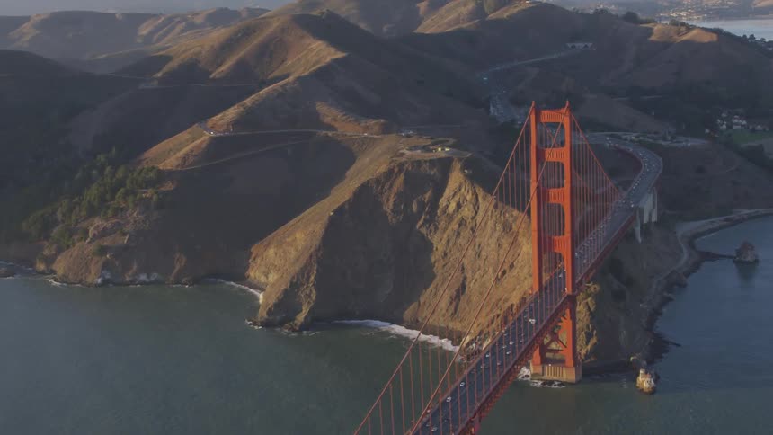 Cars are driving on a bridge