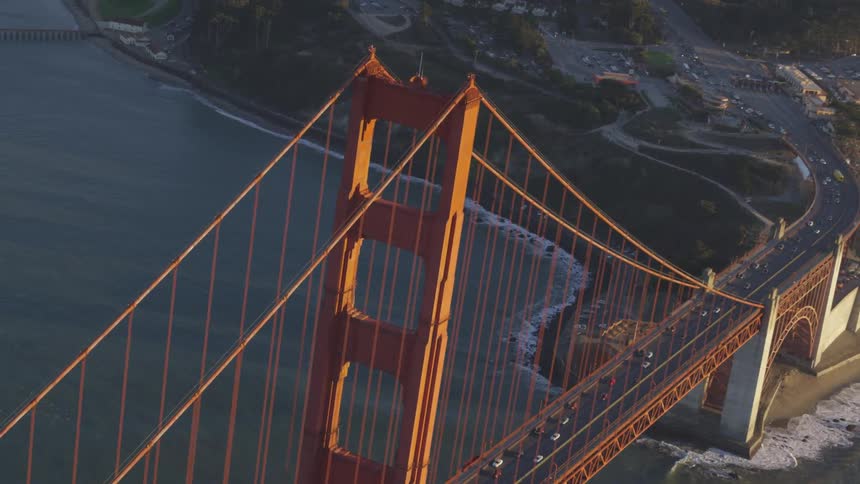 Cars are driving over a bridge