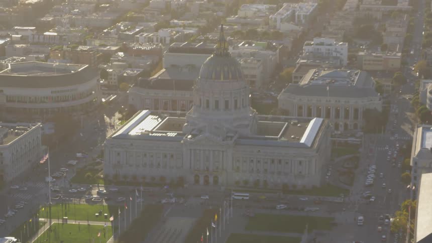 Aerial view of a city capitol building with lots of buildings surrounding it