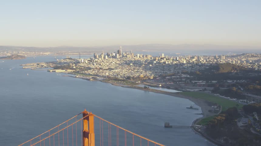 The camera flies past the golden gate bridge and san francisco