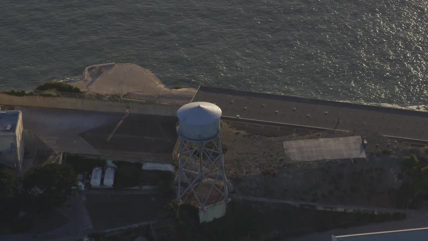 Aerial shot of a water tower near a river