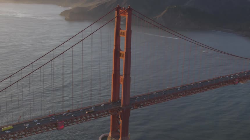 Cars passing over a large bridge