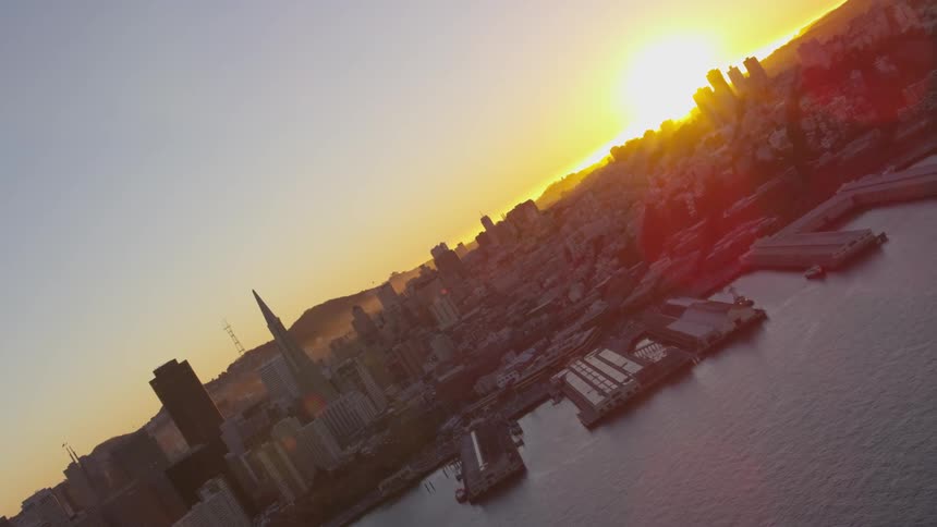 The sun is setting in the horizon in the city
