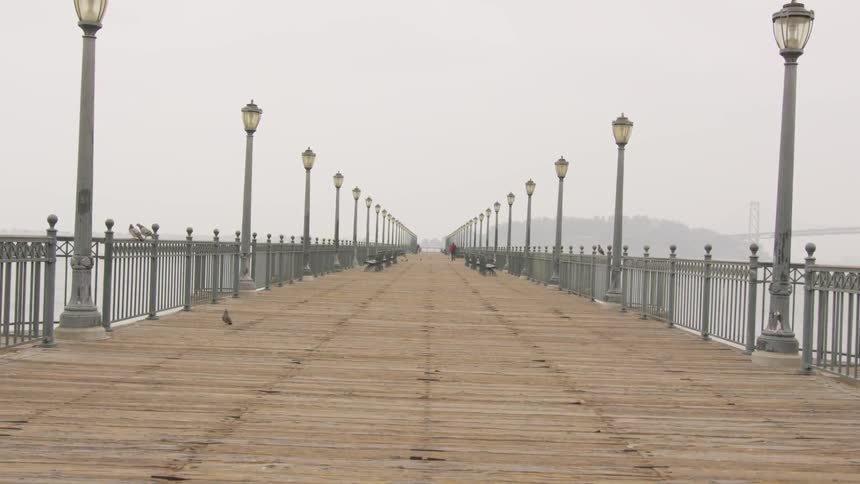 A pier with period features extends from the shoreline