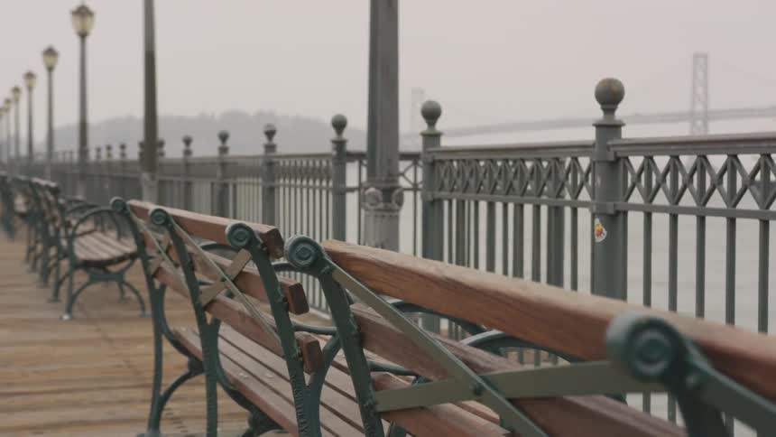 Benches overlooking the bay across from golden gate bridge on a foggy day