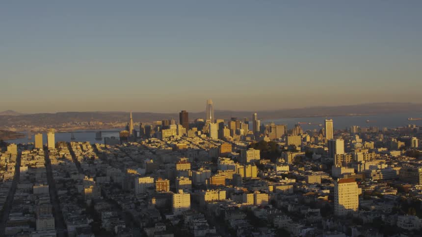 Aerial footage of a city next to some water