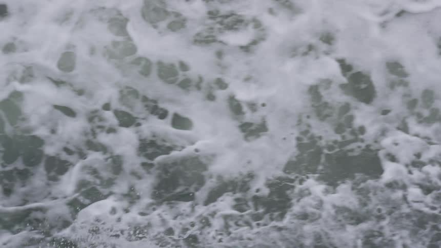 A river flows by spraying and foaming