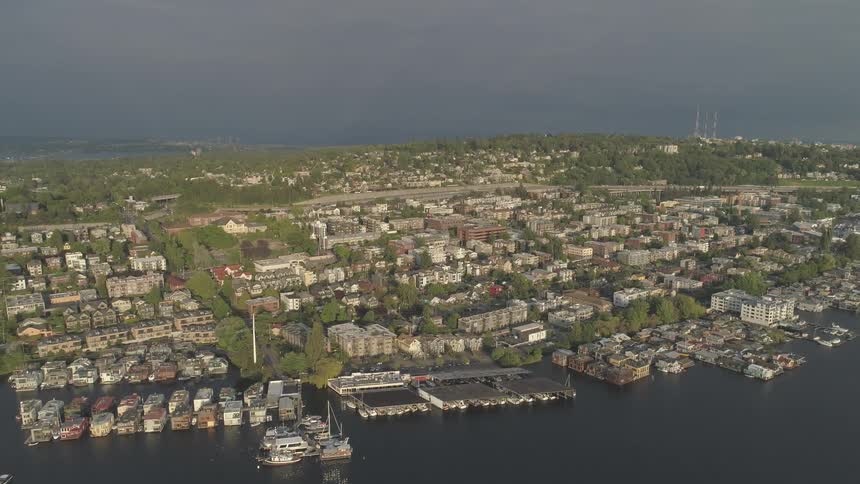 Panning shot of city surrounded by ocean