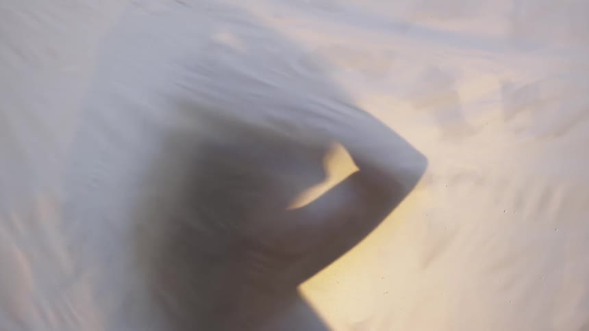 A shadow of a woman is displayed