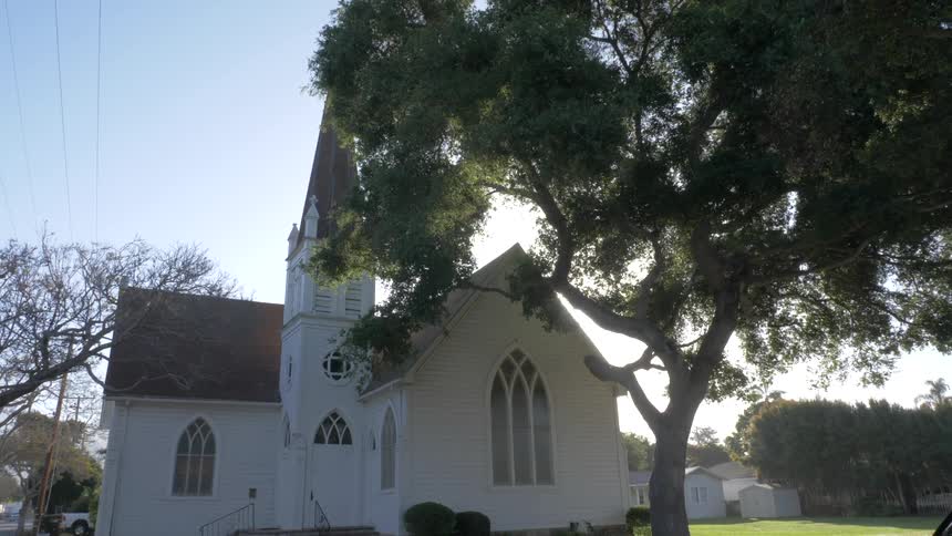 Rural church with sun in the background