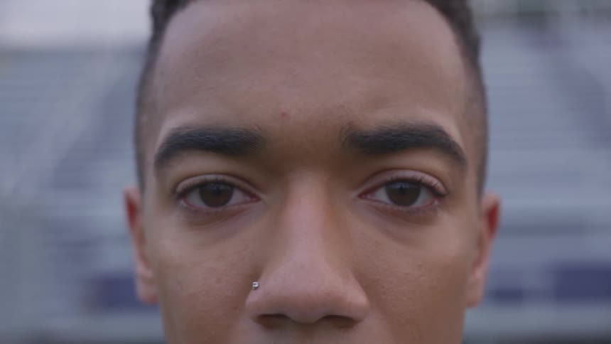 A teen stares into the camera