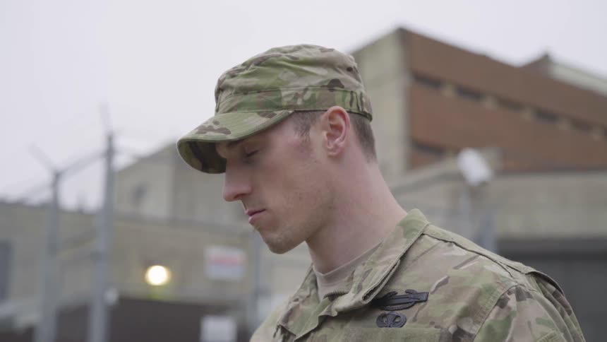 Man stands in military uniform