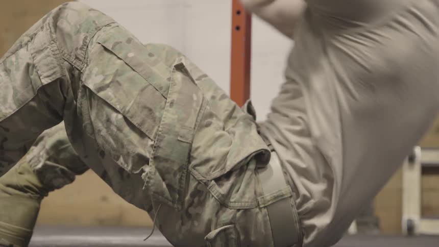 Male soldier doing sit ups