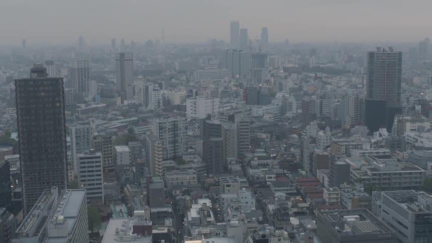 Overhead view of a city at dusk