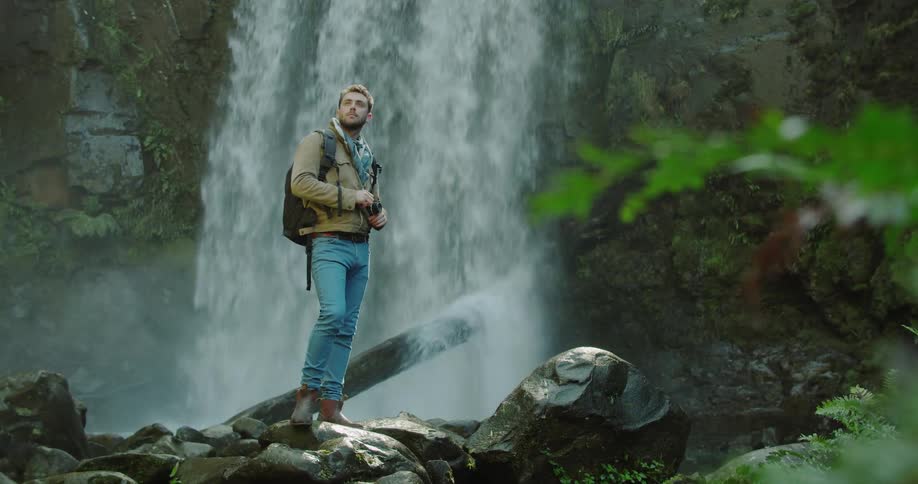 Man Exploring Waterfall