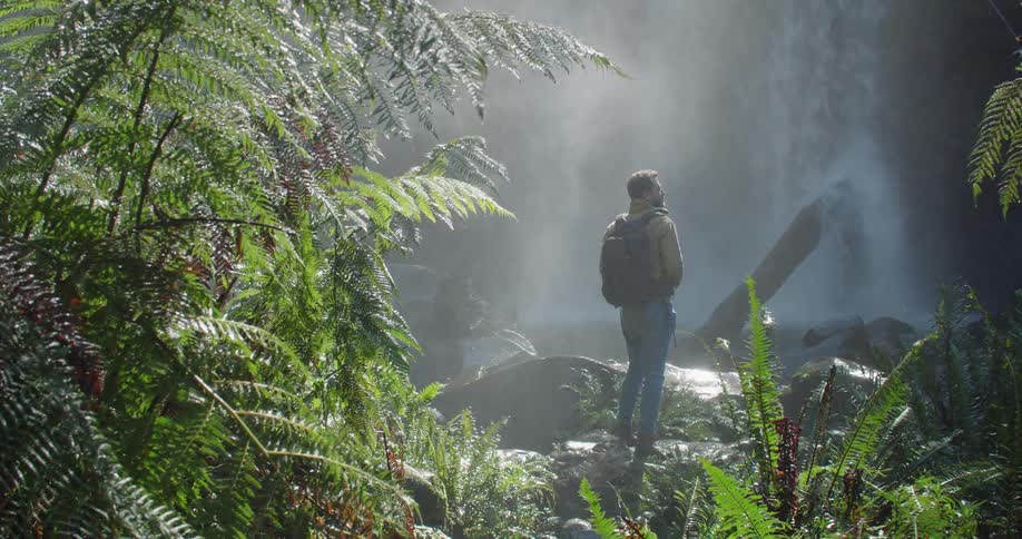 Man Exploring Waterfall