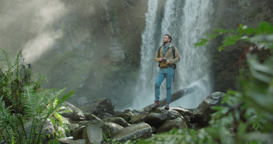 Man Exploring Waterfall