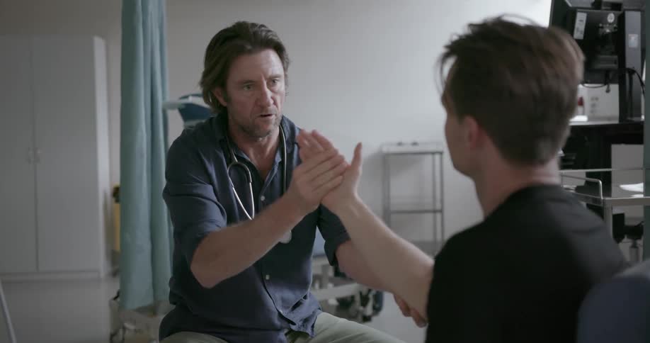 A doctor examines a patient