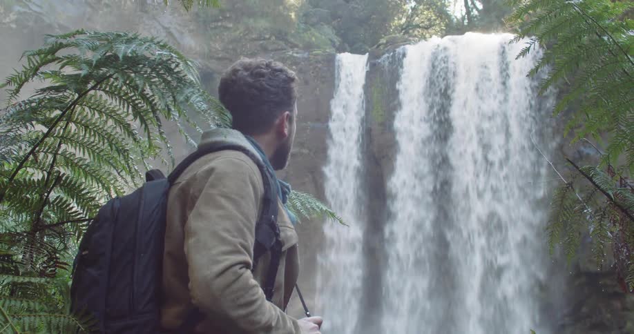 Man Exploring Waterfall