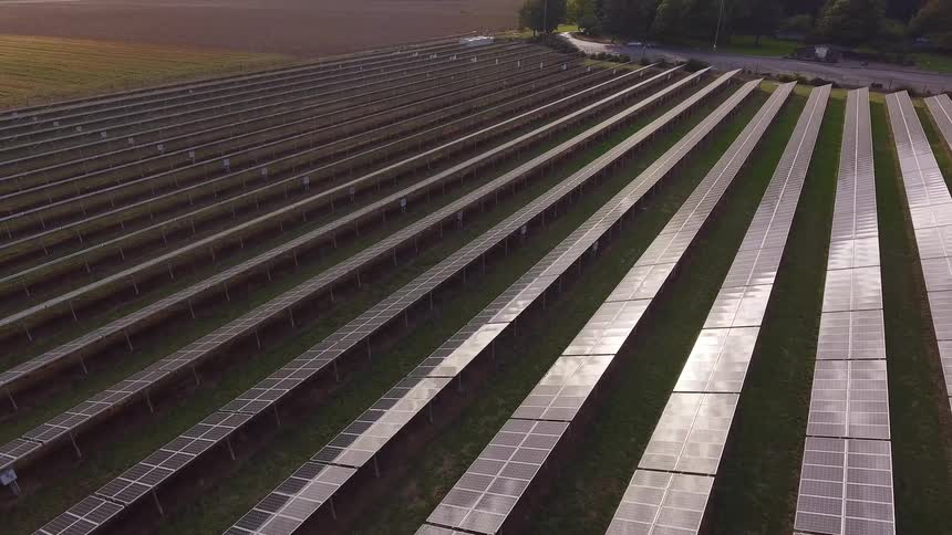 A top down view of solar panels in a field
