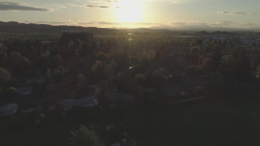 Sun setting over a suburban neighborhood