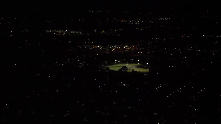 Pitch black city with twinkling lights