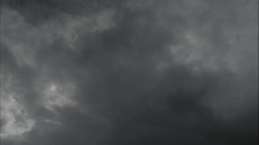 Clouds pass in front of the sun