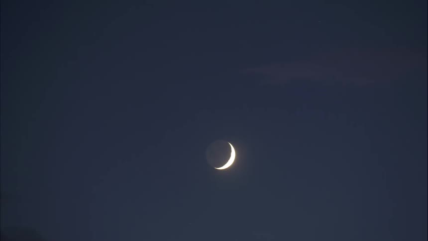 The moon is in sky and turns dark
