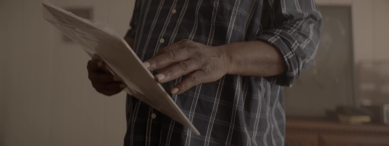 Person holds record in plastic sleeve