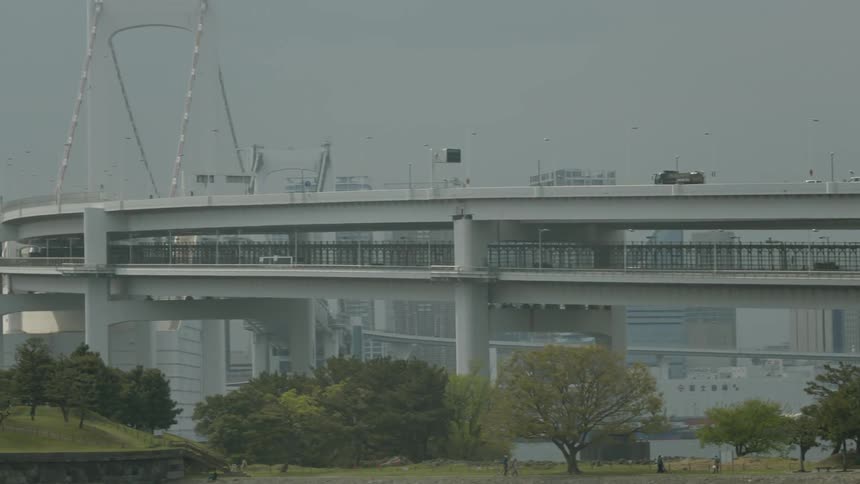 Vehicles cross a city bridge