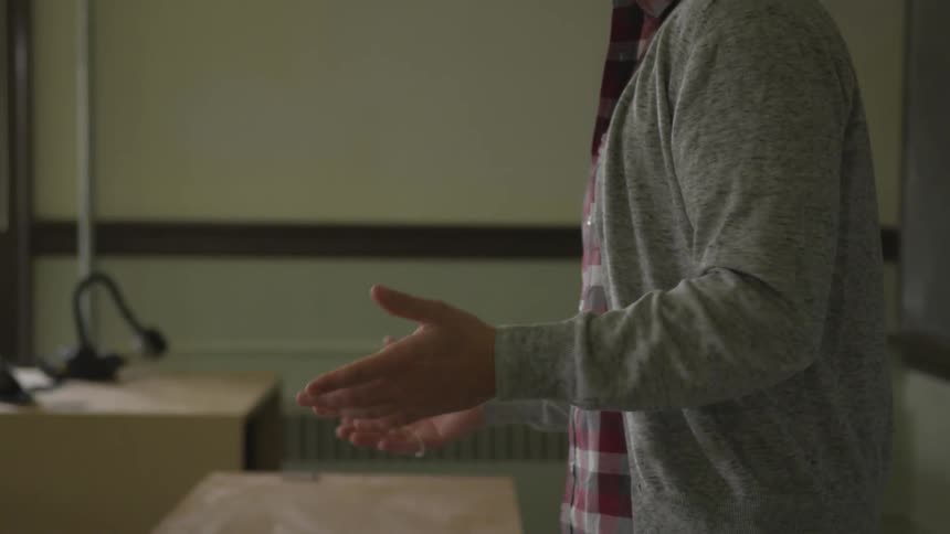 A man is talking in a classroom
