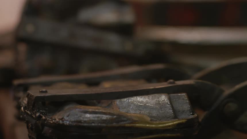 Griddles are being flipped on a large stove