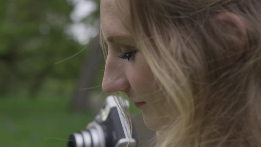 A woman holding a camera