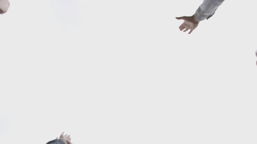 Several people raise their hands from together to the sky