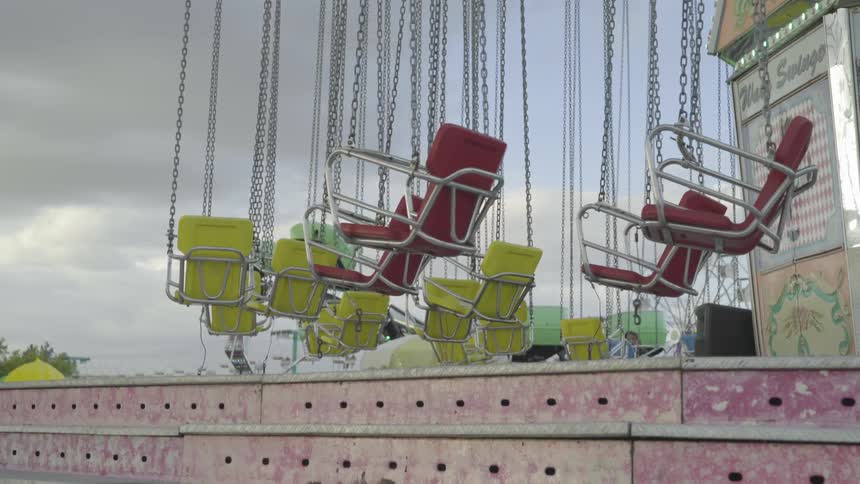 Swings sway gently with no one in them
