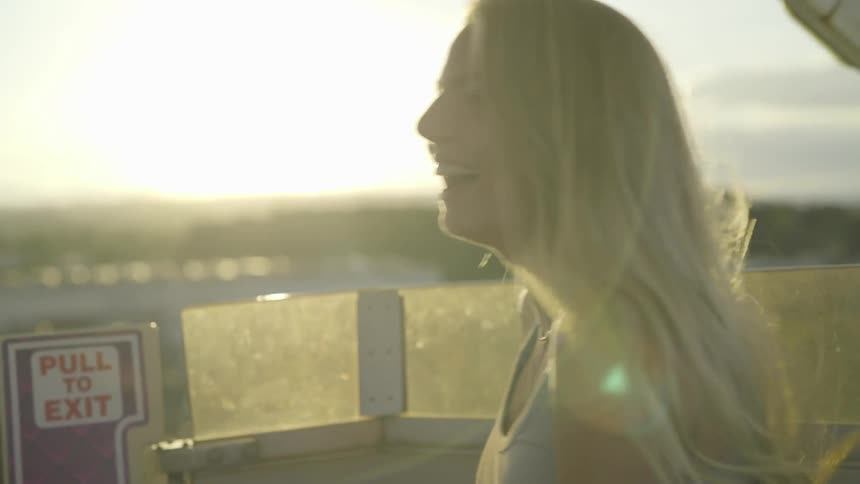 A woman laughing in the wind