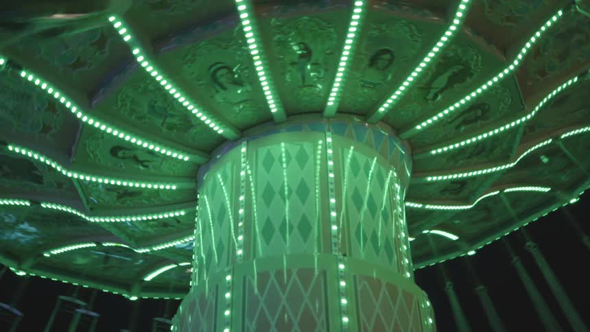 Flying chairs on an amusement park at night
