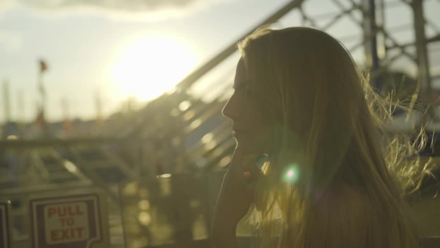 Girl rides on ferris wheel