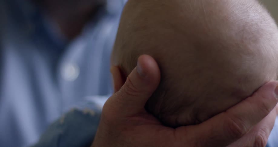Dad Holding Baby At Home