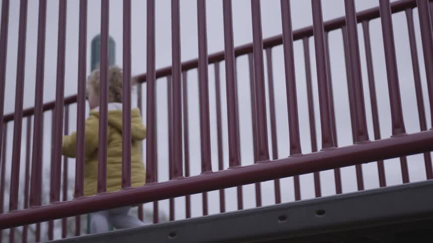 A child is walking at a playground
