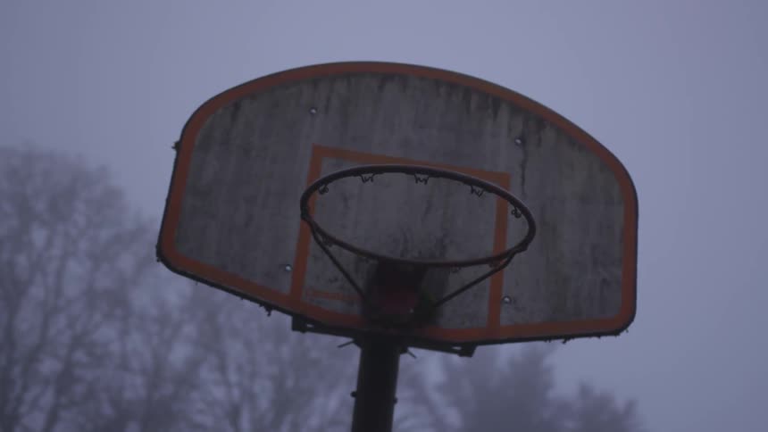 An old basketball hoop without the net