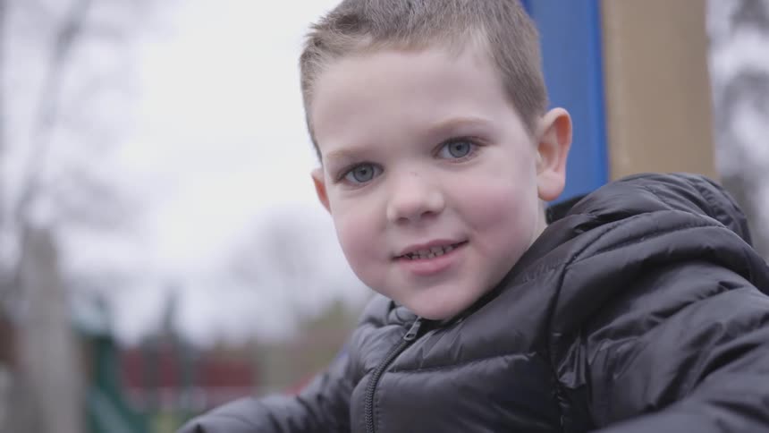Young child plays at the park