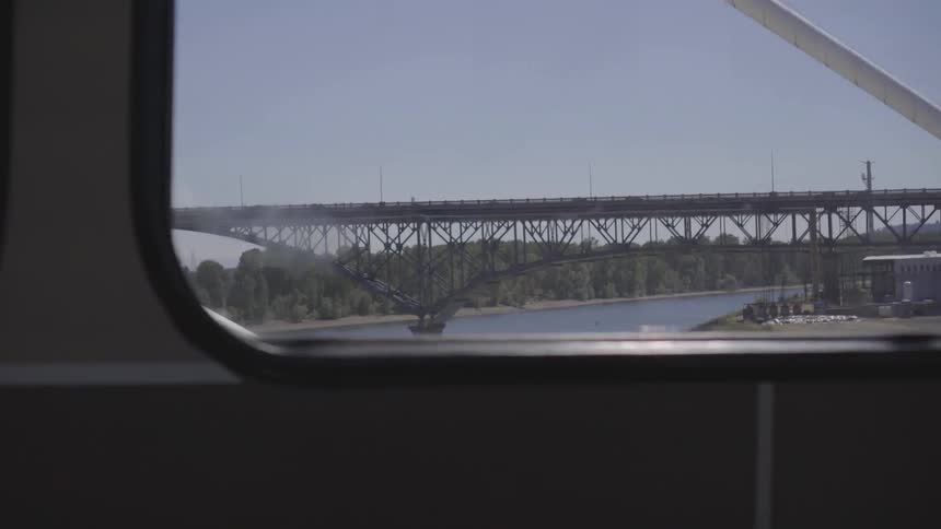 View from inside vehicle of bridge