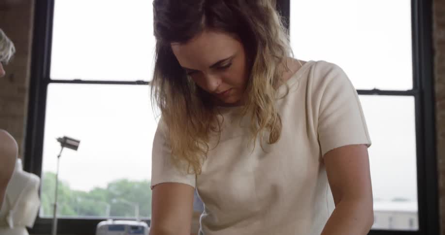 A woman traces a pattern