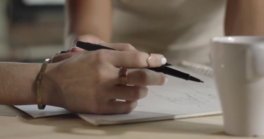 A person is drawing a cartoon